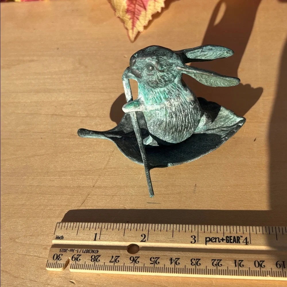 Vintage Bronze Rabbit Paddling A Leaf Boat